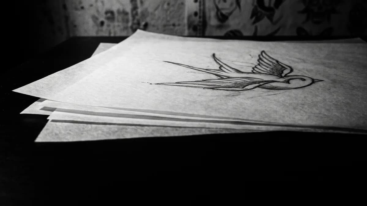 Bocetos a lápiz sobre papel vegetal apilados, con un trazo… — tatuajes parejas Cartagena, Delorean Tattoo Studio Cartagena